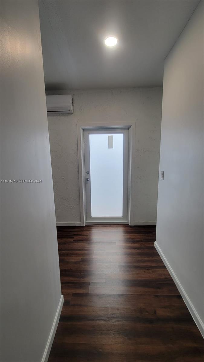 10172 Southwest 159th Avenue Miami, FL 33196 - Photo 6 of 10 a view of hallway with wooden floor