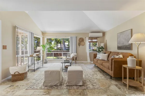 a living room with furniture and a large window