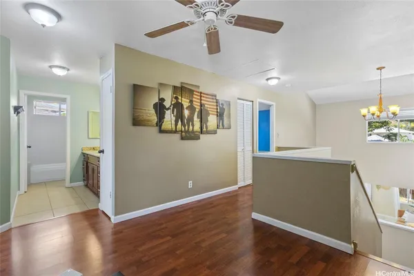 a view of livingroom with hardwood floor and ceiling fan