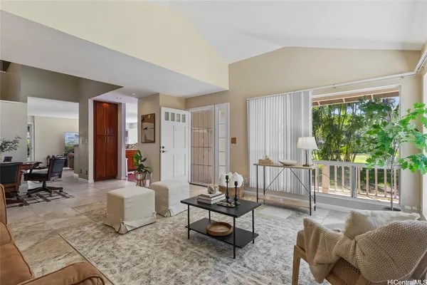 a living room with furniture and a large window