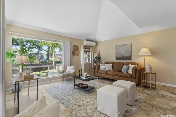 a living room with furniture and a large window