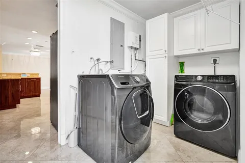 a view of a kitchen with washer and dryer
