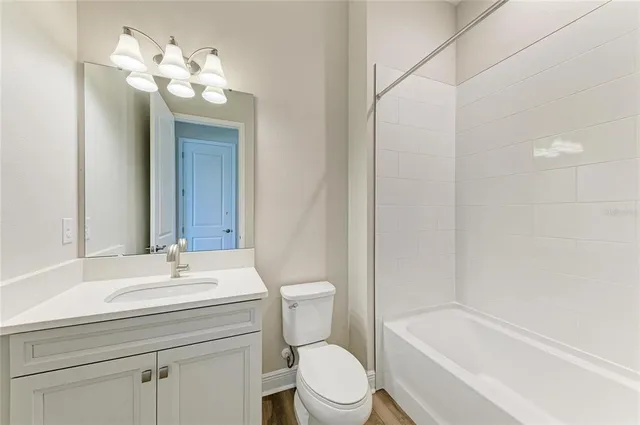 a bathroom with a sink a toilet and a bathtub