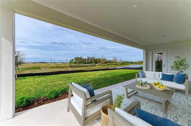 a view of a patio with furniture