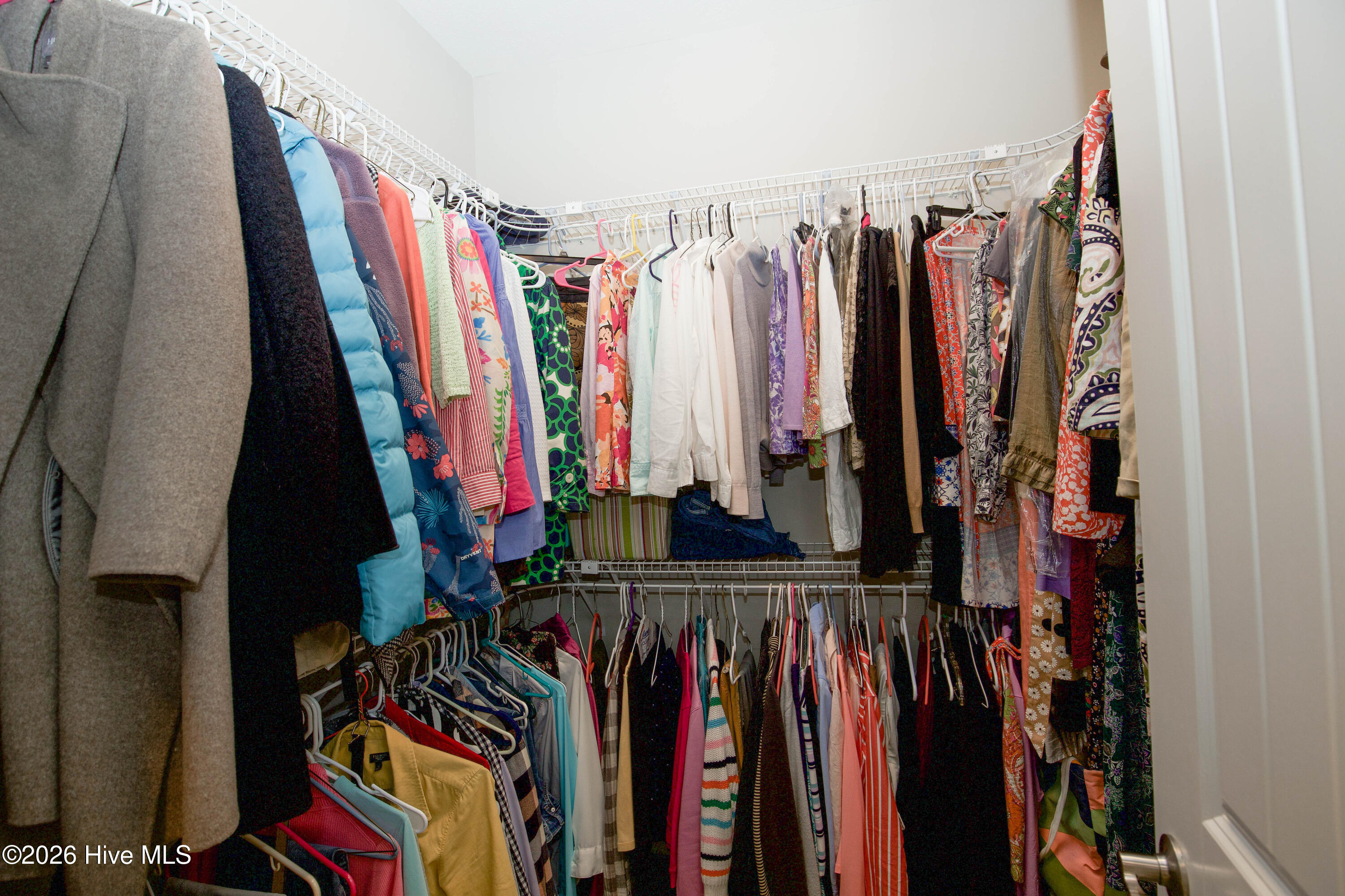 45 Richmond Road Jackson Springs, NC 27281 - Photo 36 of 93 This spacious walk-in closet off the primary suite at 45 Richmond Rd offers ample hanging space, and room for organization, combining practicality with everyday comfort.