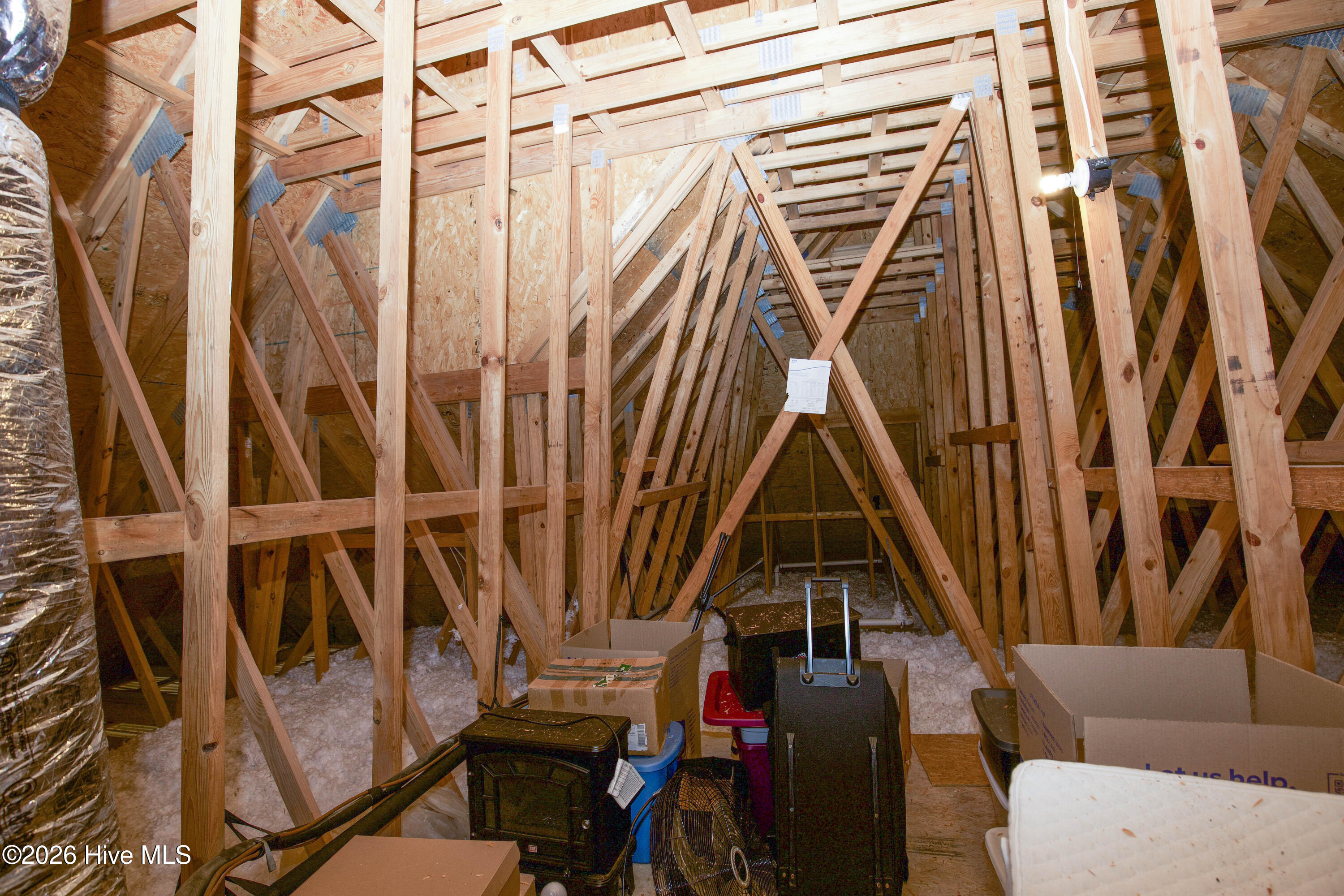 45 Richmond Road Jackson Springs, NC 27281 - Photo 71 of 93 This large, unfinished attic offers an abundance of accessible storage space, ideal for seasonal items, luggage, and more.
