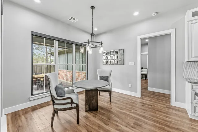 a view of livingroom with window and wooden floor
