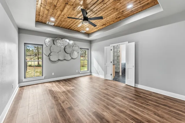 a view of a livingroom with wooden floor