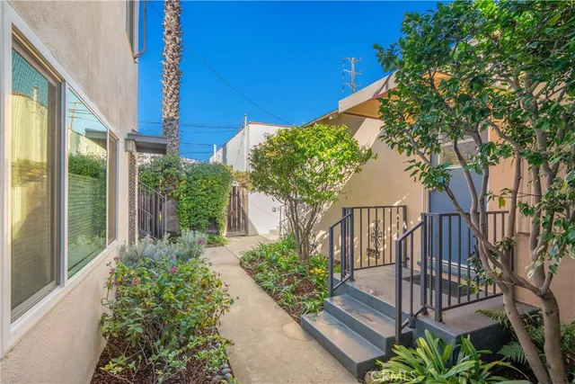 a view of a house with a flower garden