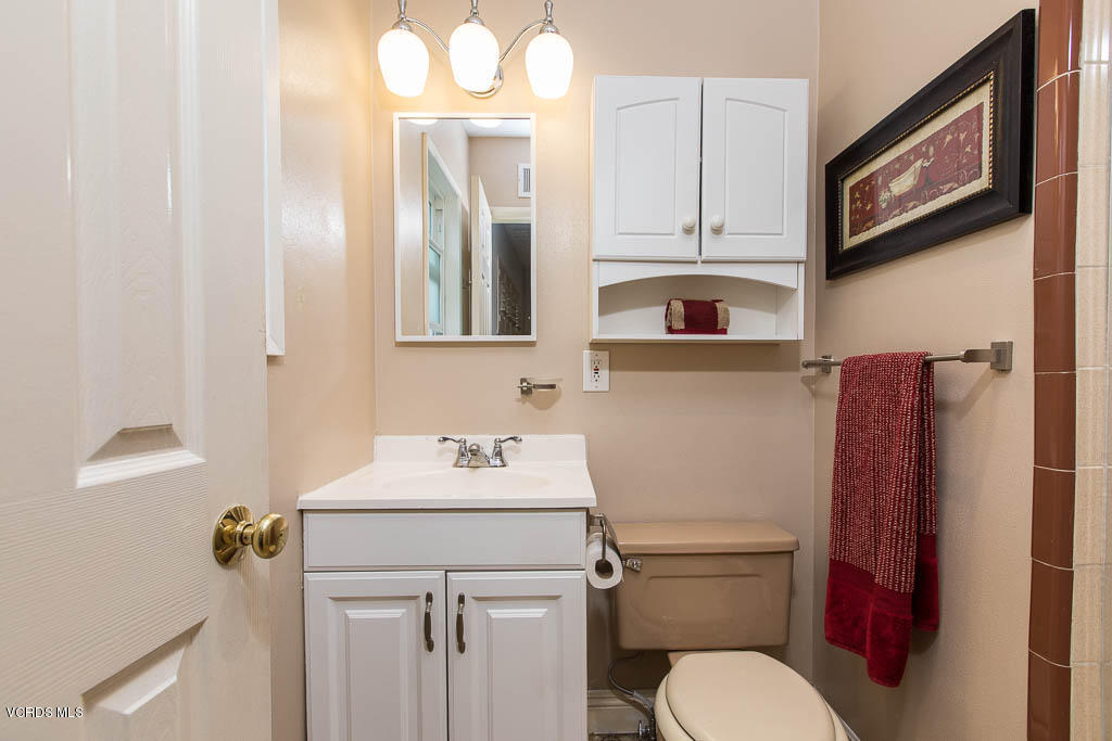4238 Adam Road Simi Valley, CA 93063 - Photo 15 of 35 a bathroom with a sink a toilet and a mirror