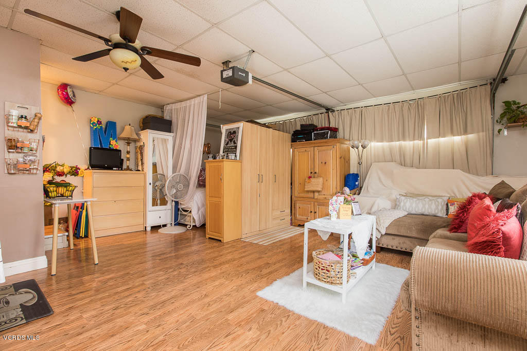 4238 Adam Road Simi Valley, CA 93063 - Photo 19 of 35 a living room with furniture and a flat screen tv