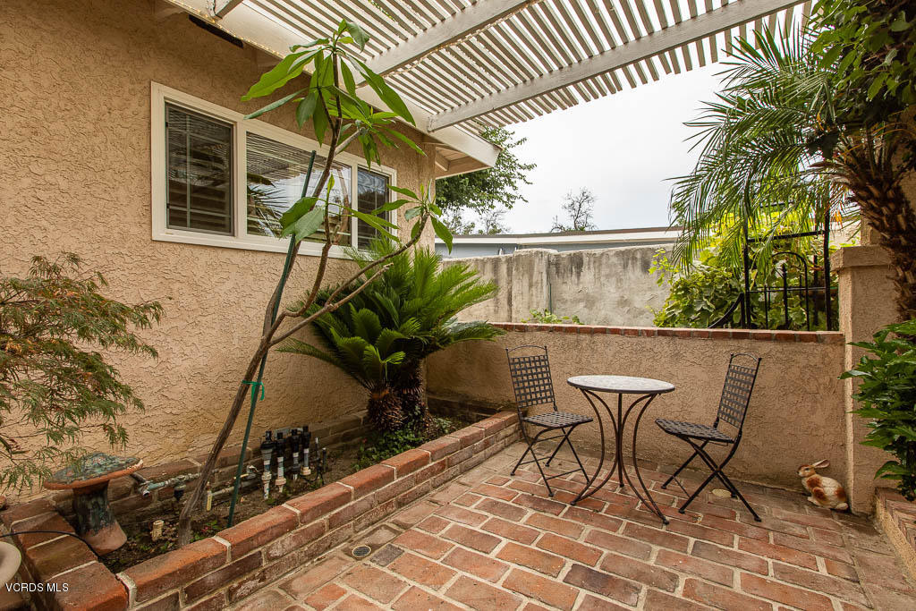 4238 Adam Road Simi Valley, CA 93063 - Photo 3 of 35 a view of a chairs and table in the patio