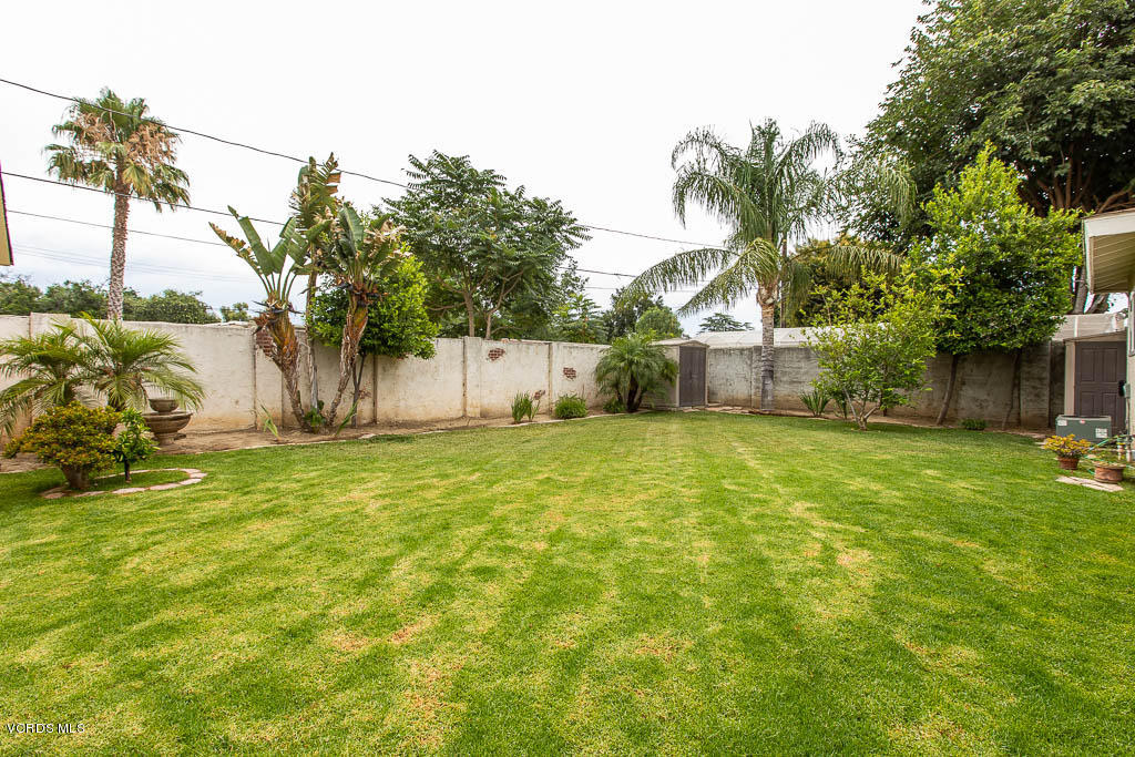 4238 Adam Road Simi Valley, CA 93063 - Photo 21 of 35 a backyard of a house with table and chairs