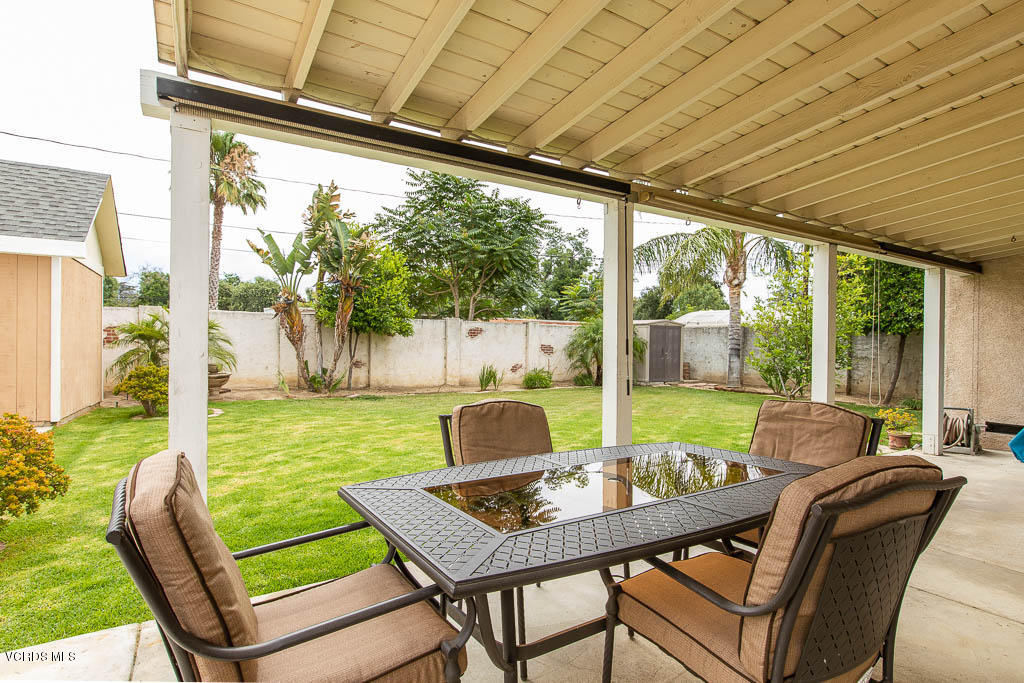 4238 Adam Road Simi Valley, CA 93063 - Photo 25 of 35 a view of a patio with a table chairs and a backyard