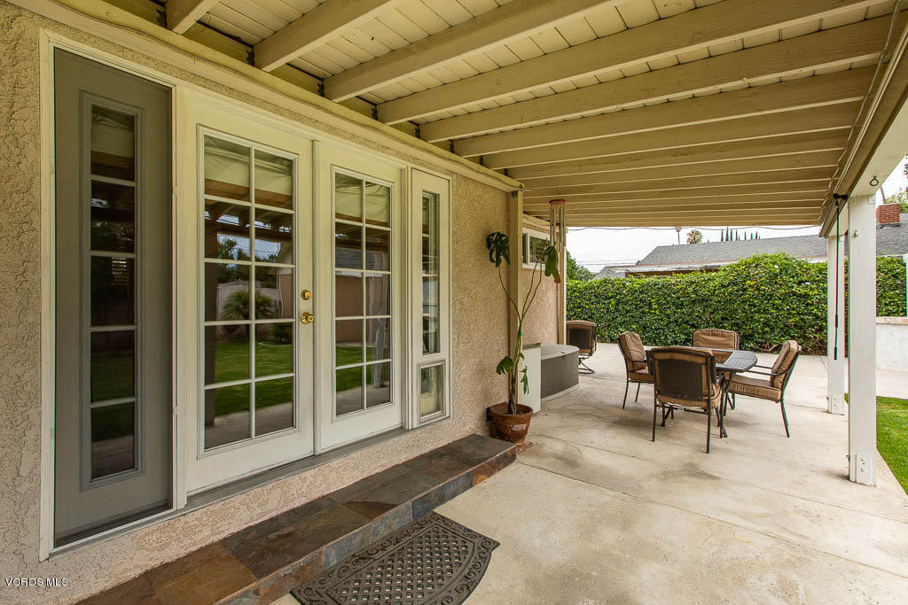 4238 Adam Road Simi Valley, CA 93063 - Photo 27 of 35 a view of a porch with furniture and a yard