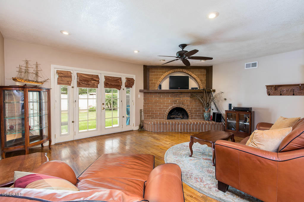 4238 Adam Road Simi Valley, CA 93063 - Photo 9 of 35 a living room with furniture and a fireplace