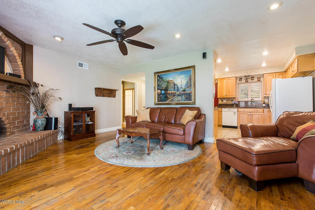 4238 Adam Road Simi Valley, CA 93063 - Photo 10 of 35 a living room with furniture and a wooden floor