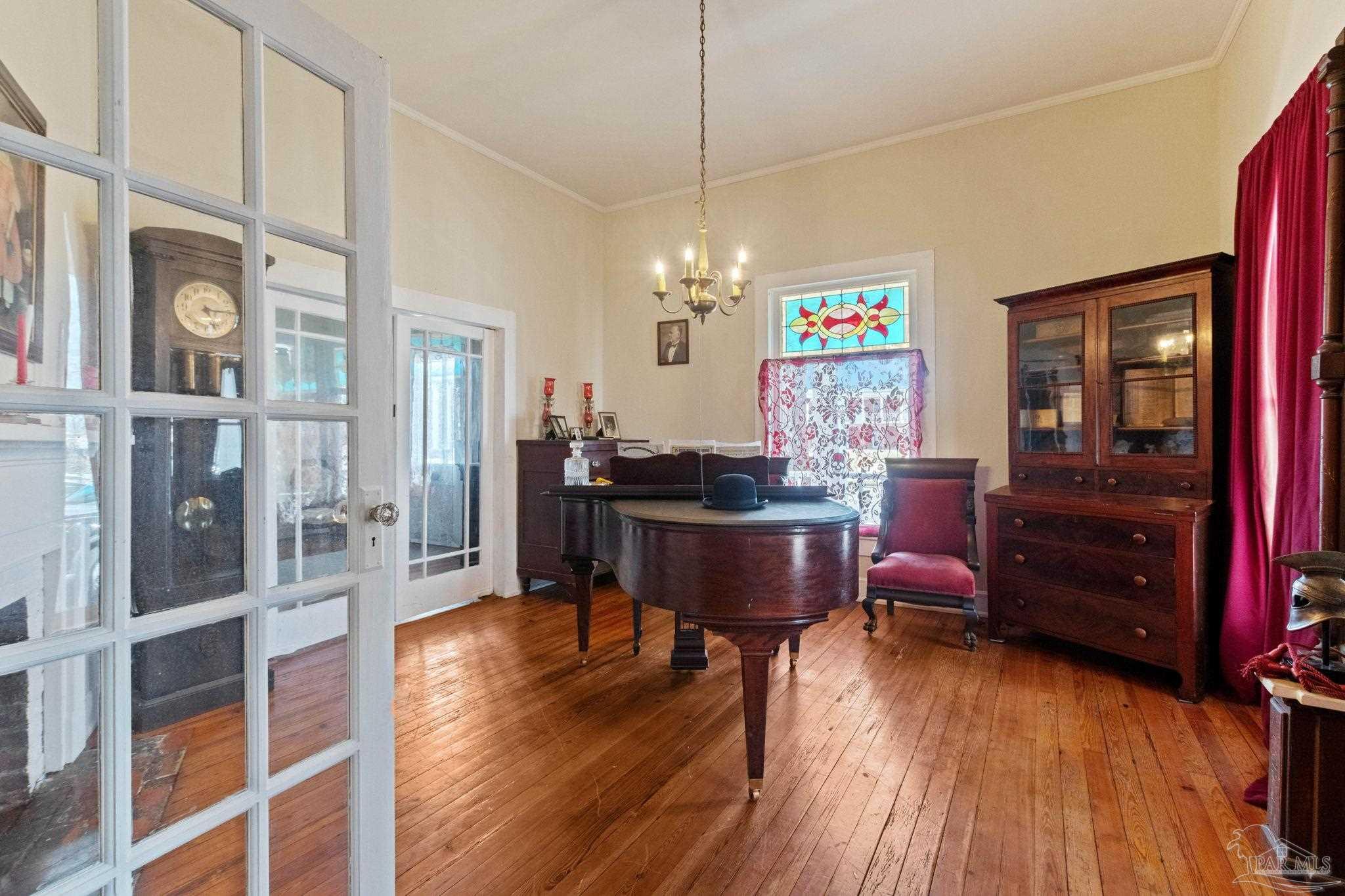 309 South Main Street Atmore, AL 36502 - Photo 12 of 47 a living room with furniture and a wooden floor
