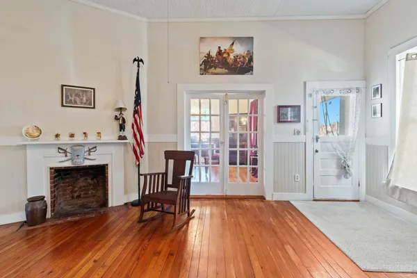 a view of a livingroom with furniture and a fireplace