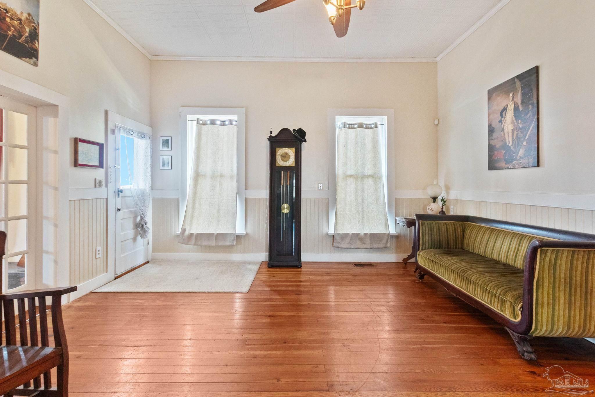 309 South Main Street Atmore, AL 36502 - Photo 16 of 47 a living room with furniture and a wooden floor