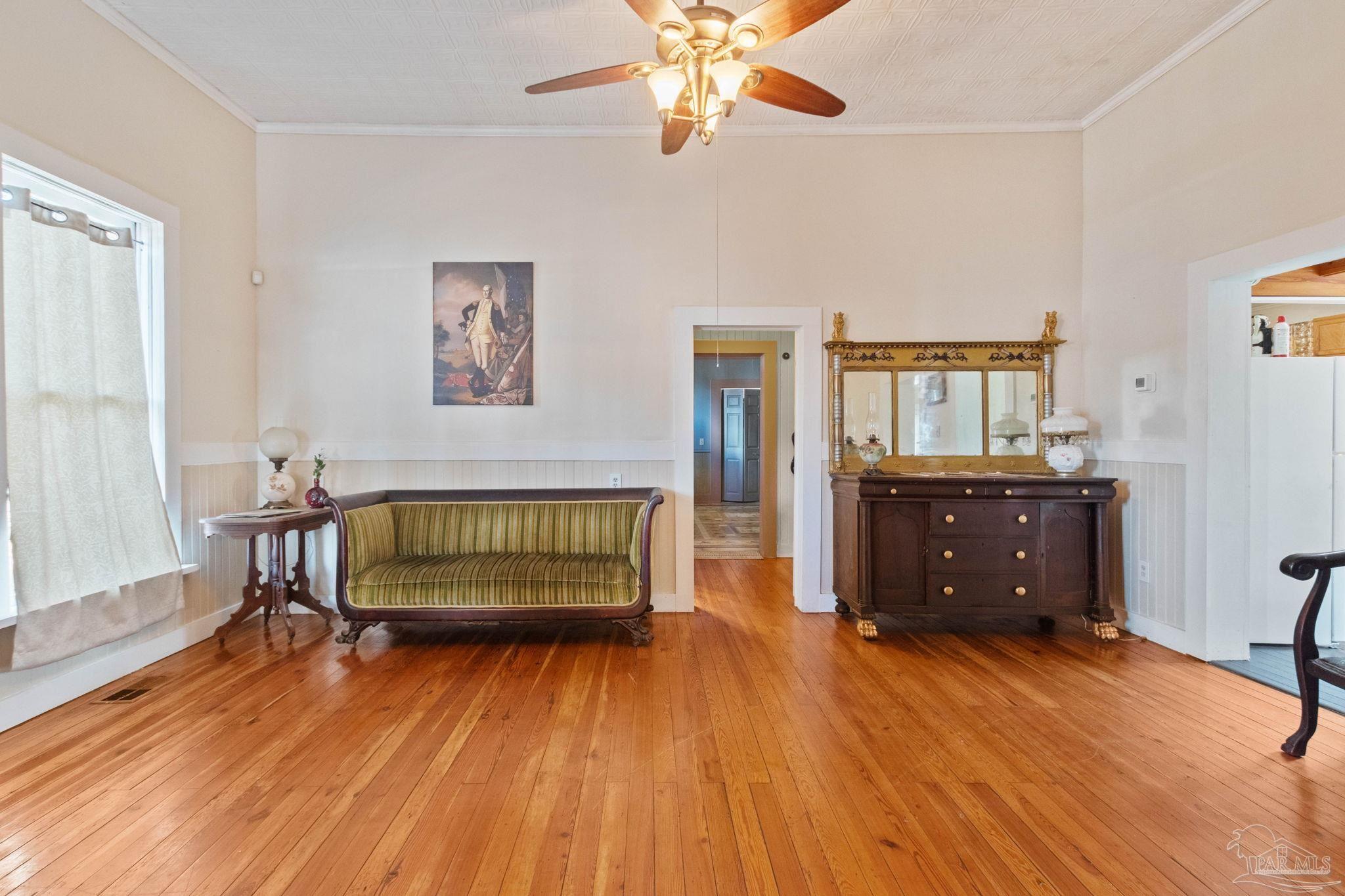 309 South Main Street Atmore, AL 36502 - Photo 17 of 47 a bedroom with a bed and a dresser in it