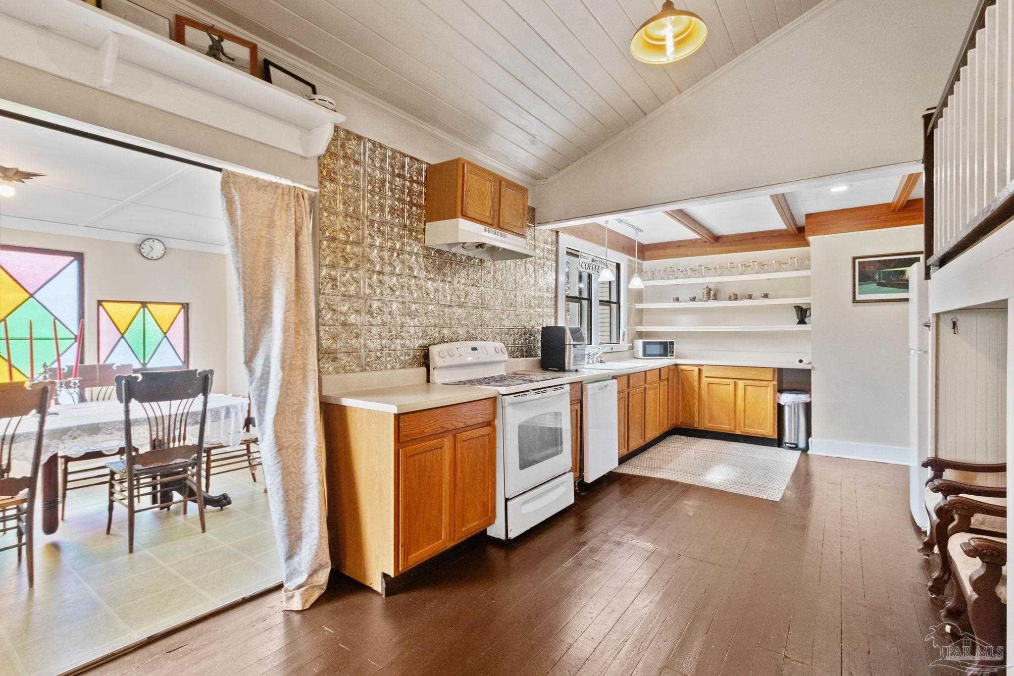 309 South Main Street Atmore, AL 36502 - Photo 19 of 47 a kitchen with stainless steel appliances a stove a sink and a refrigerator