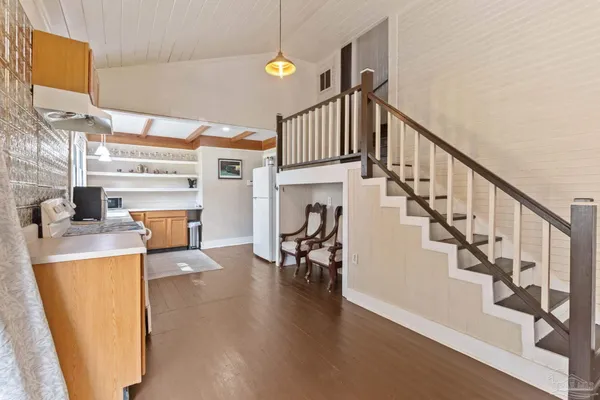 a view of entryway and hall with wooden floor