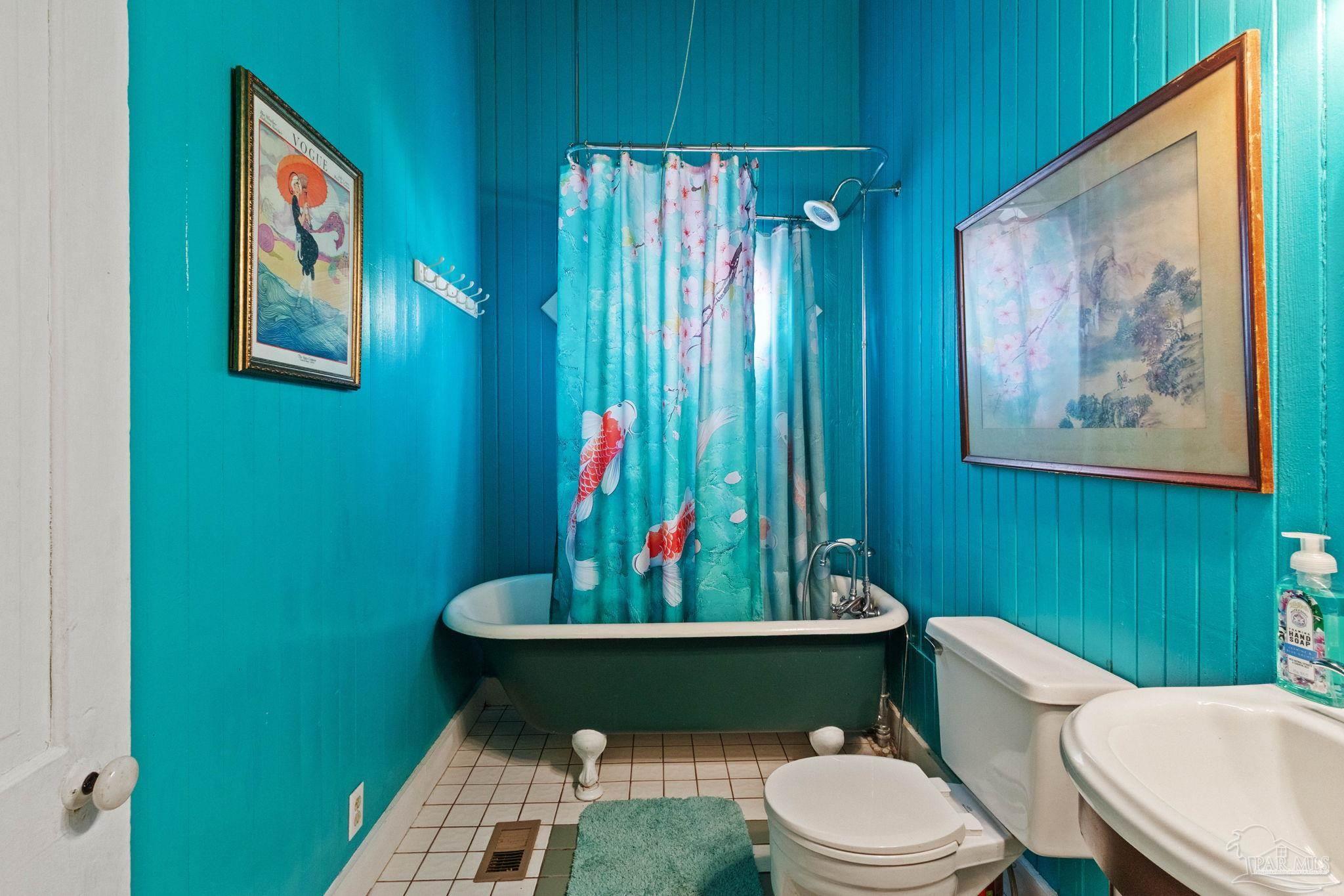 309 South Main Street Atmore, AL 36502 - Photo 24 of 47 a bathroom with a toilet a sink and a mirror