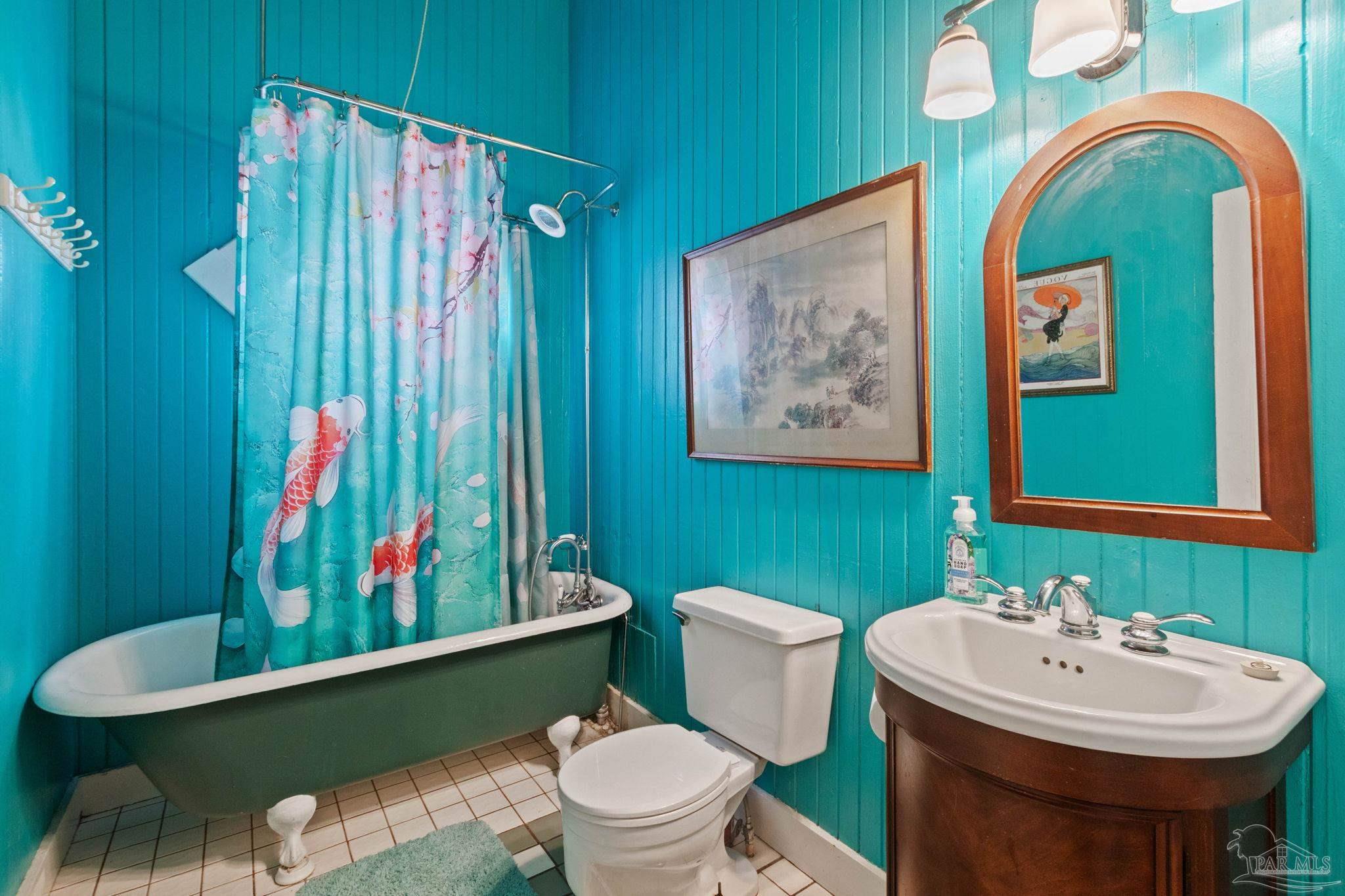 309 South Main Street Atmore, AL 36502 - Photo 25 of 47 a bathroom with a sink mirror vanity and toilet