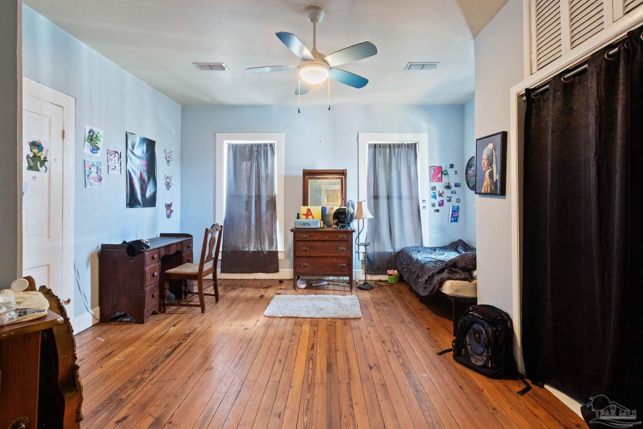 309 South Main Street Atmore, AL 36502 - Photo 37 of 47 a living room with furniture and a chandelier