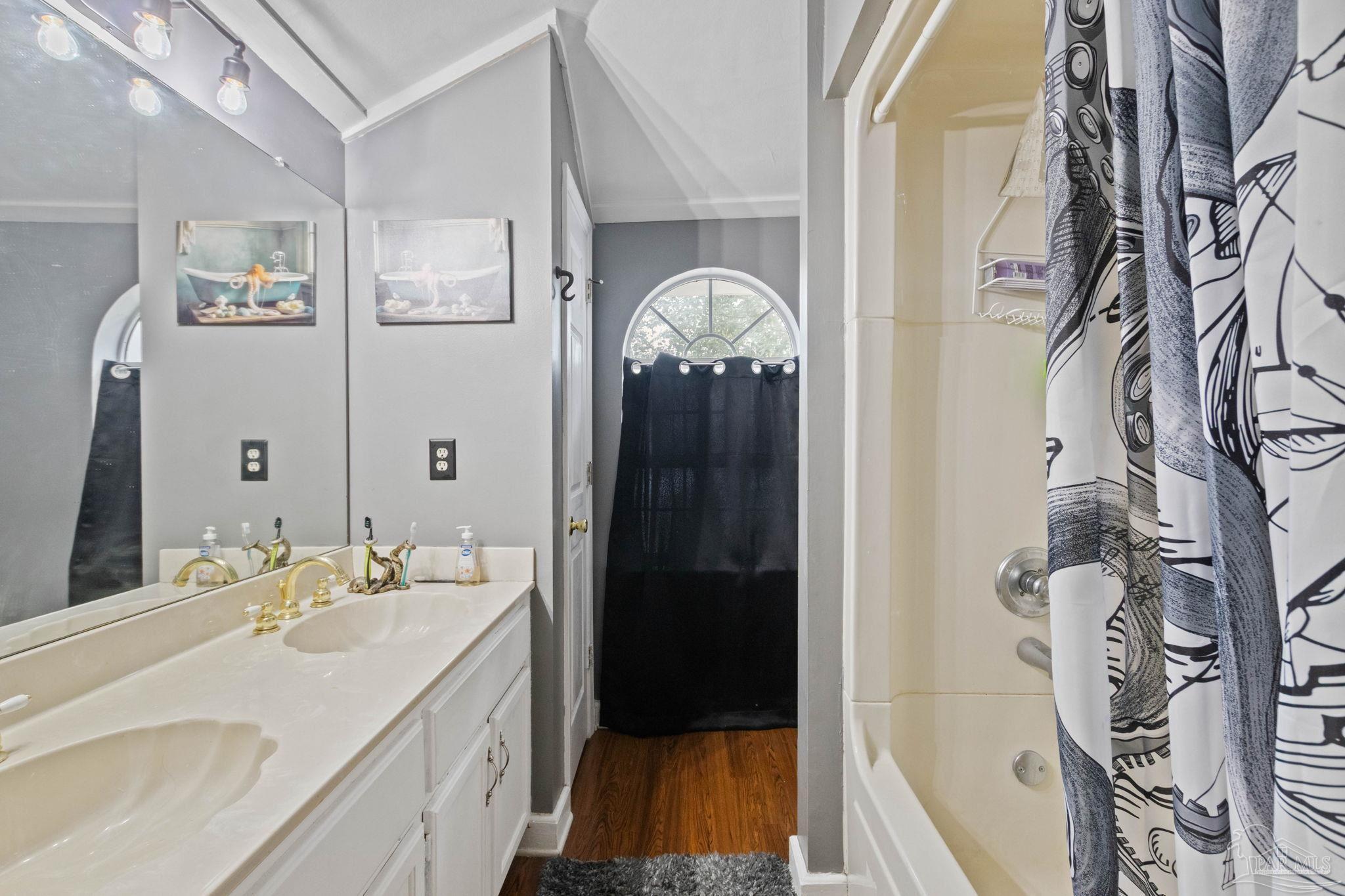 309 South Main Street Atmore, AL 36502 - Photo 40 of 47 a bathroom with a sink and a mirror