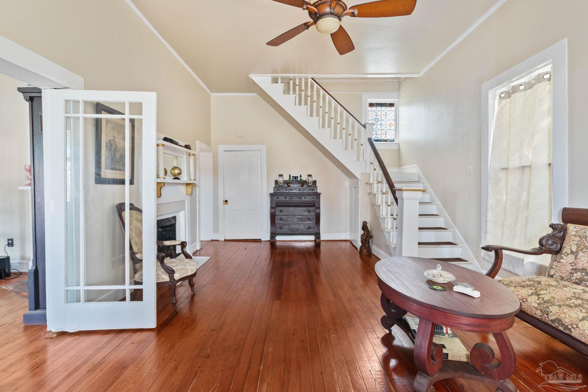 309 South Main Street Atmore, AL 36502 - Photo 7 of 47 a living room with furniture and a wooden floor