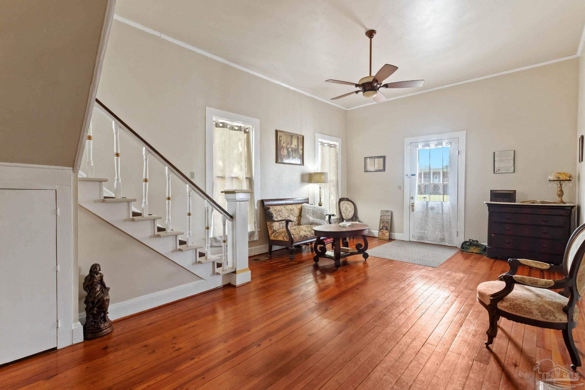 309 South Main Street Atmore, AL 36502 - Photo 9 of 47 a living room with furniture and a wooden floor