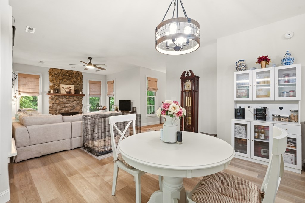 175 Crane Creek Road Young Harris, GA 30582 - Photo 14 of 40 a view of a dining room with furniture and chandelier