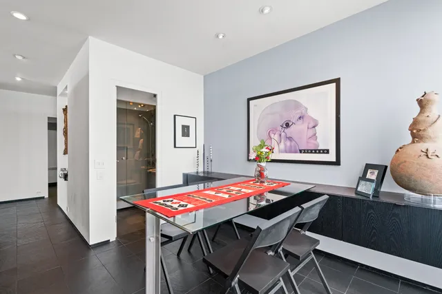 a dining room with furniture and wooden floor