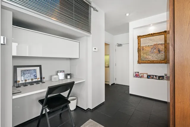 a workspace with furniture and window