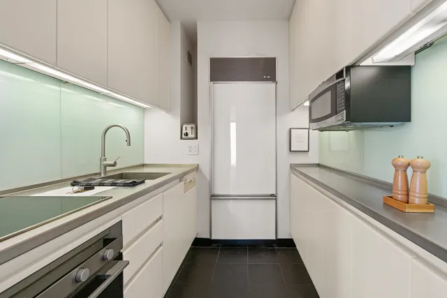 a kitchen with a stove and a refrigerator