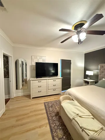 a bathroom with a sink a mirror a vanity and a shower