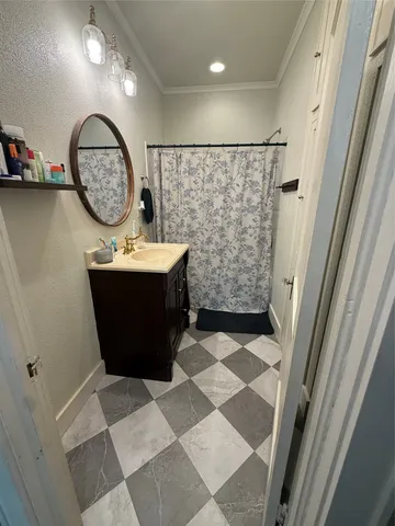 a living room with furniture floor to ceiling window and a flat screen tv