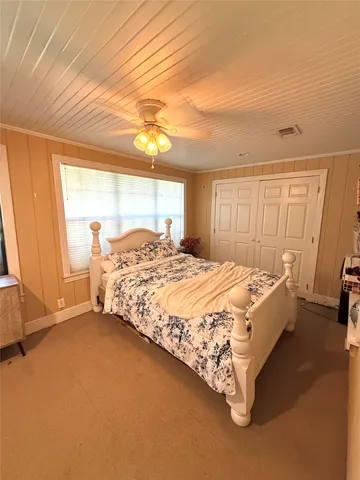 a bedroom with furniture and window