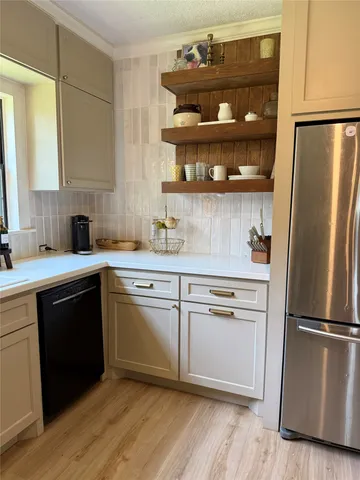 a spacious bedroom with two beds and a fireplace