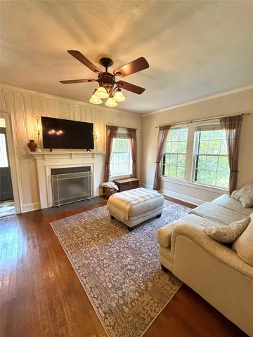 a view of a living room and entry way
