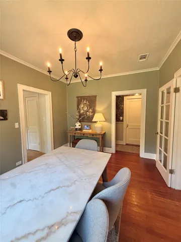 a large bed sitting in a bedroom next to a lamp