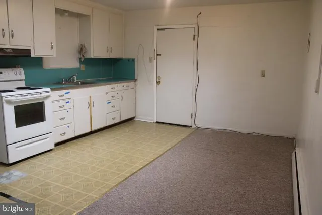 a view of a kitchen with cabinets