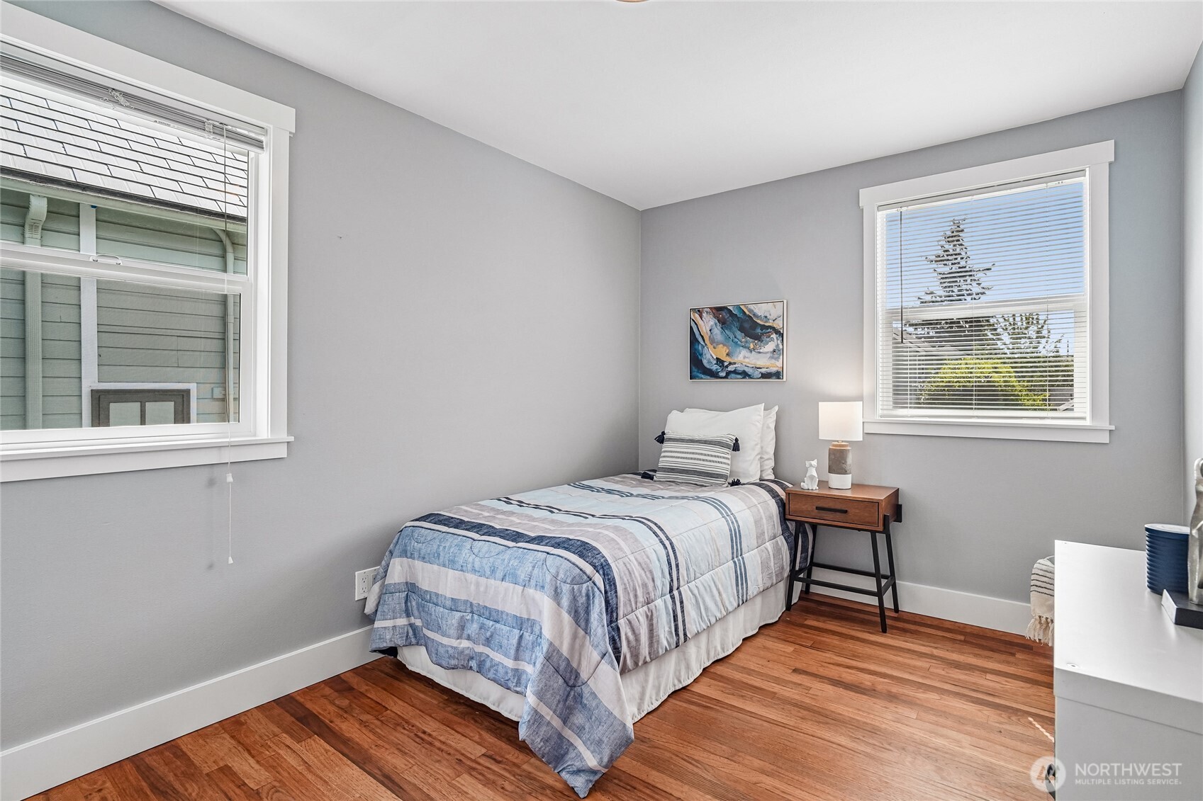 7313 25th Avenue Northwest Seattle, WA 98117 - Photo 14 of 40 a bedroom with a bed and a window