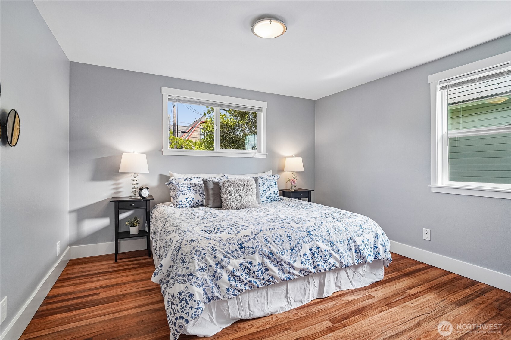 7313 25th Avenue Northwest Seattle, WA 98117 - Photo 16 of 40 a bedroom with a bed and wooden floor