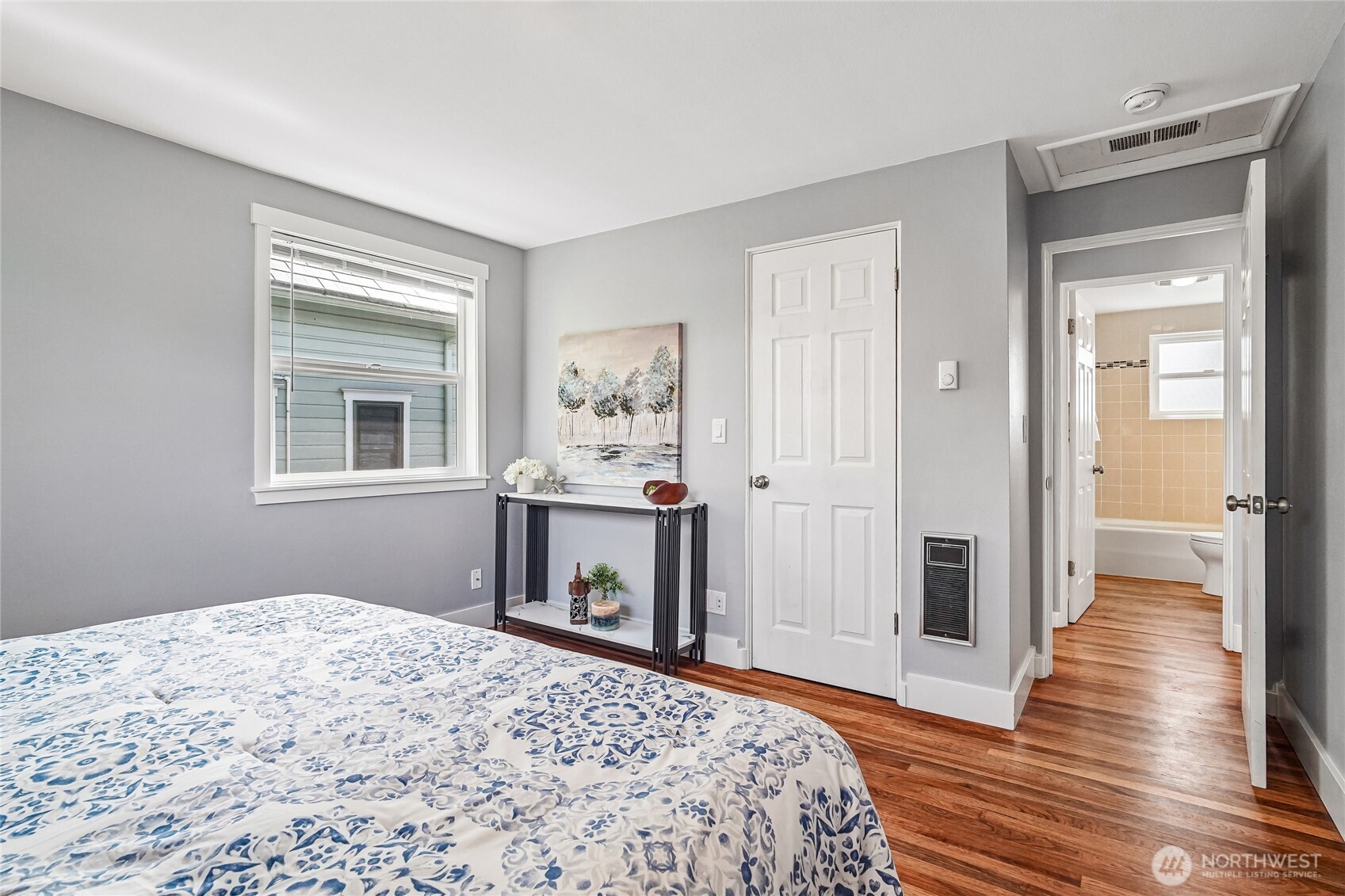 7313 25th Avenue Northwest Seattle, WA 98117 - Photo 17 of 40 a bedroom with a bed and a window