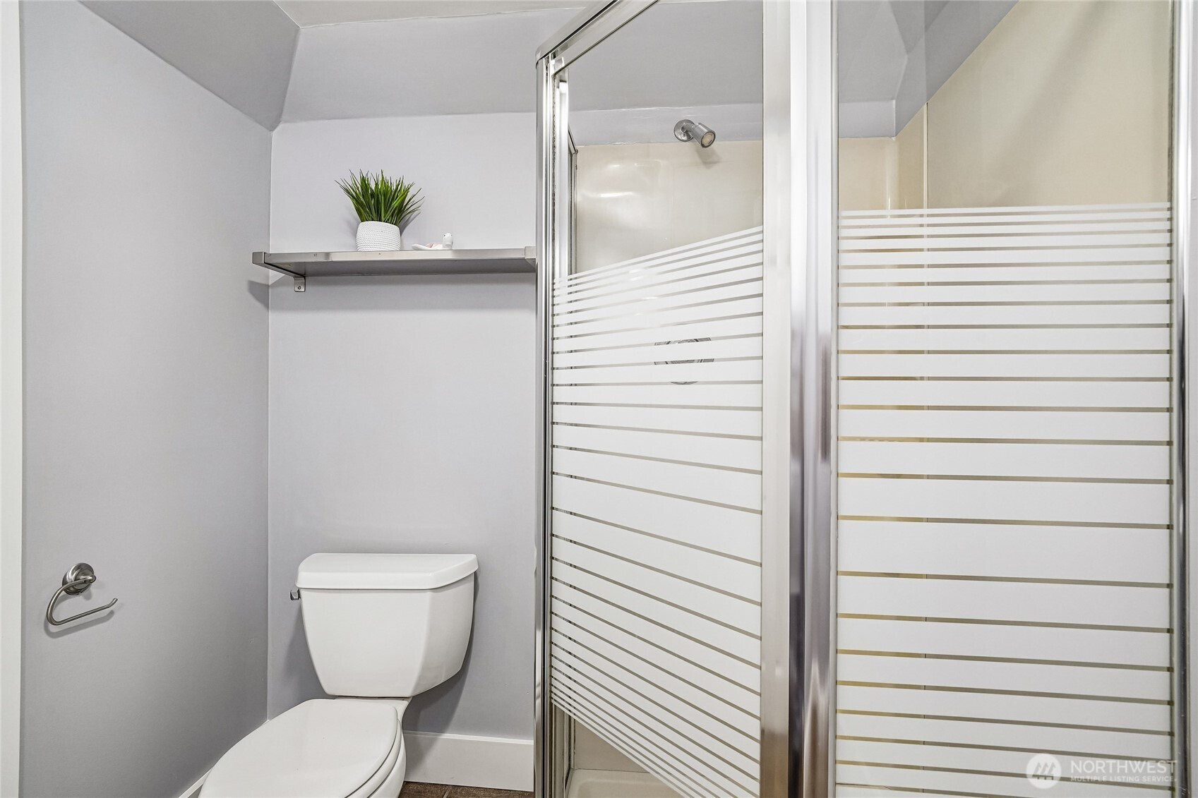 7313 25th Avenue Northwest Seattle, WA 98117 - Photo 19 of 40 a bathroom with a toilet and a shower