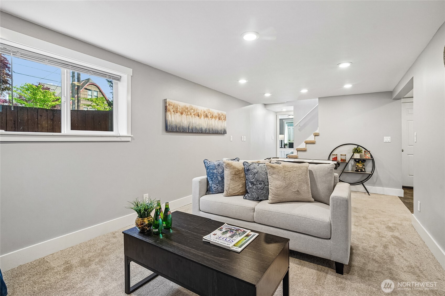 7313 25th Avenue Northwest Seattle, WA 98117 - Photo 23 of 40 a living room with furniture and a potted plant