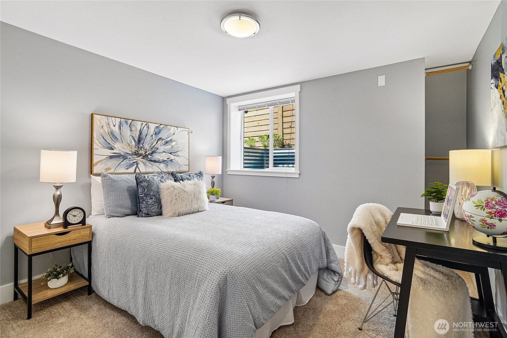 7313 25th Avenue Northwest Seattle, WA 98117 - Photo 25 of 40 a bedroom with a bed and a lamp on table